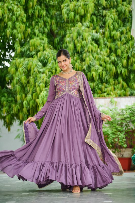 Celebrating the season in this stunning silk gown, beautifully paired with a dupatta