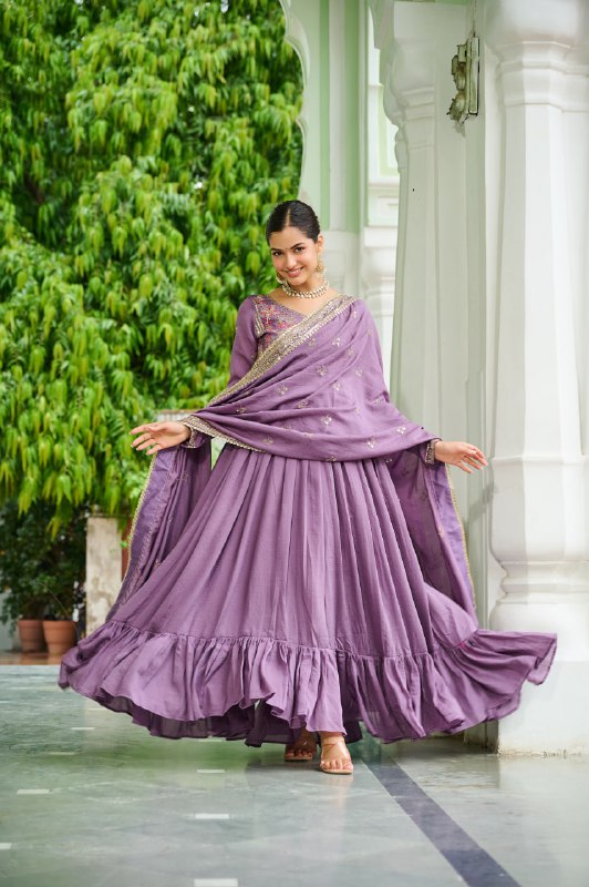 Celebrating the season in this stunning silk gown, beautifully paired with a dupatta