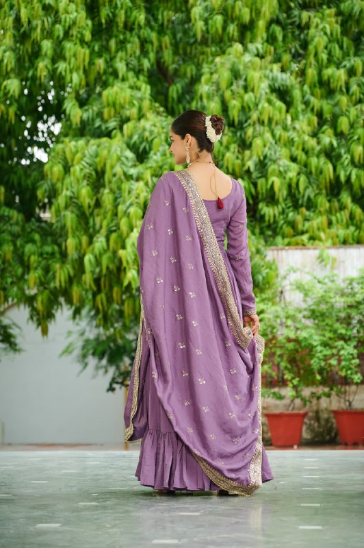 Celebrating the season in this stunning silk gown, beautifully paired with a dupatta