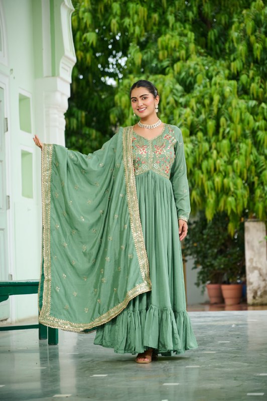 Celebrating the season in this stunning silk gown, beautifully paired with a dupatta