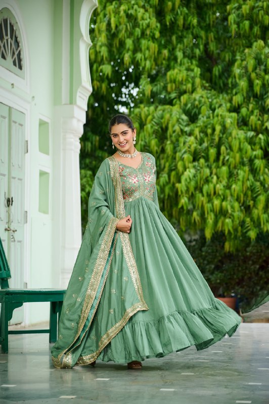 Celebrating the season in this stunning silk gown, beautifully paired with a dupatta