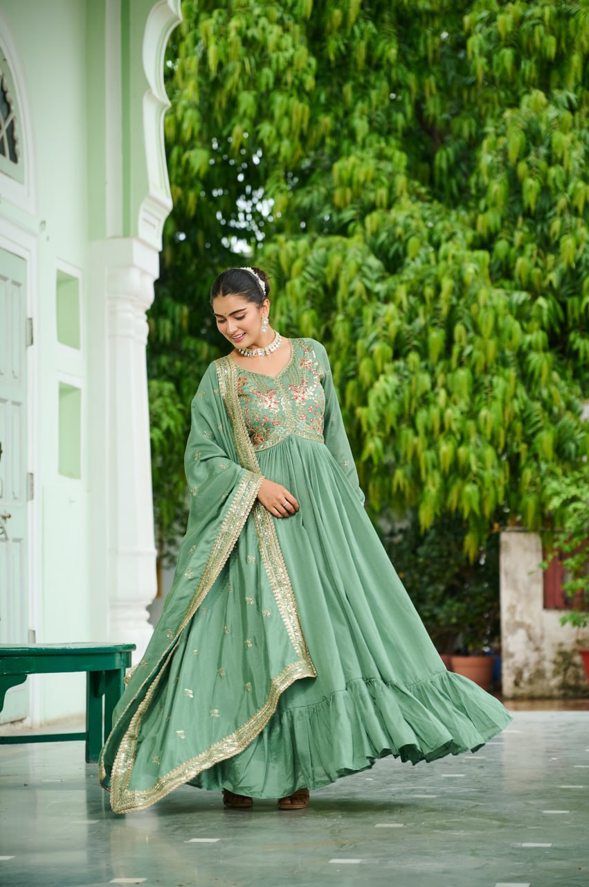 Celebrating the season in this stunning silk gown, beautifully paired with a dupatta