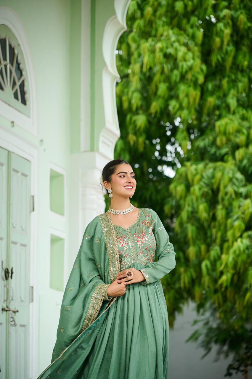 Celebrating the season in this stunning silk gown, beautifully paired with a dupatta
