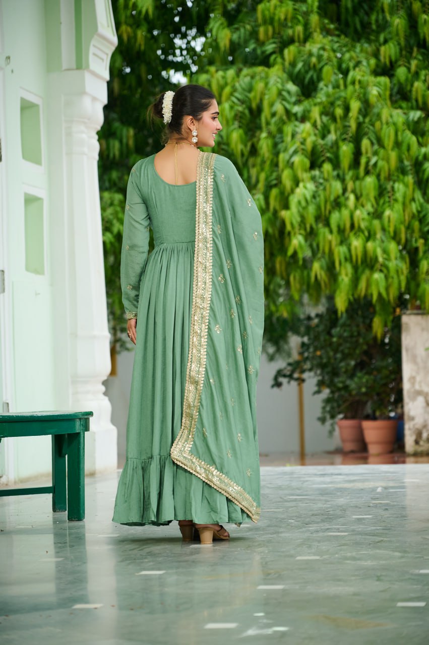 Celebrating the season in this stunning silk gown, beautifully paired with a dupatta
